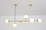 contemporary-multi-glass-globe-pendant-light-with-round-orb-shades-and-polished-brass-frame
