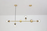 contemporary-multi-glass-globe-pendant-light-with-round-orb-shades-and-polished-brass-frame
