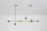 contemporary-multi-glass-globe-pendant-light-with-round-orb-shades-and-polished-brass-frame