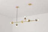 contemporary-multi-glass-globe-pendant-light-with-round-orb-shades-and-polished-brass-frame