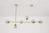 contemporary-multi-glass-globe-pendant-light-with-round-orb-shades-and-polished-brass-frame