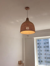 handwoven-natural-rattan-globe-pendant-lamp-for-coastal-and-bohemian-living-spaces