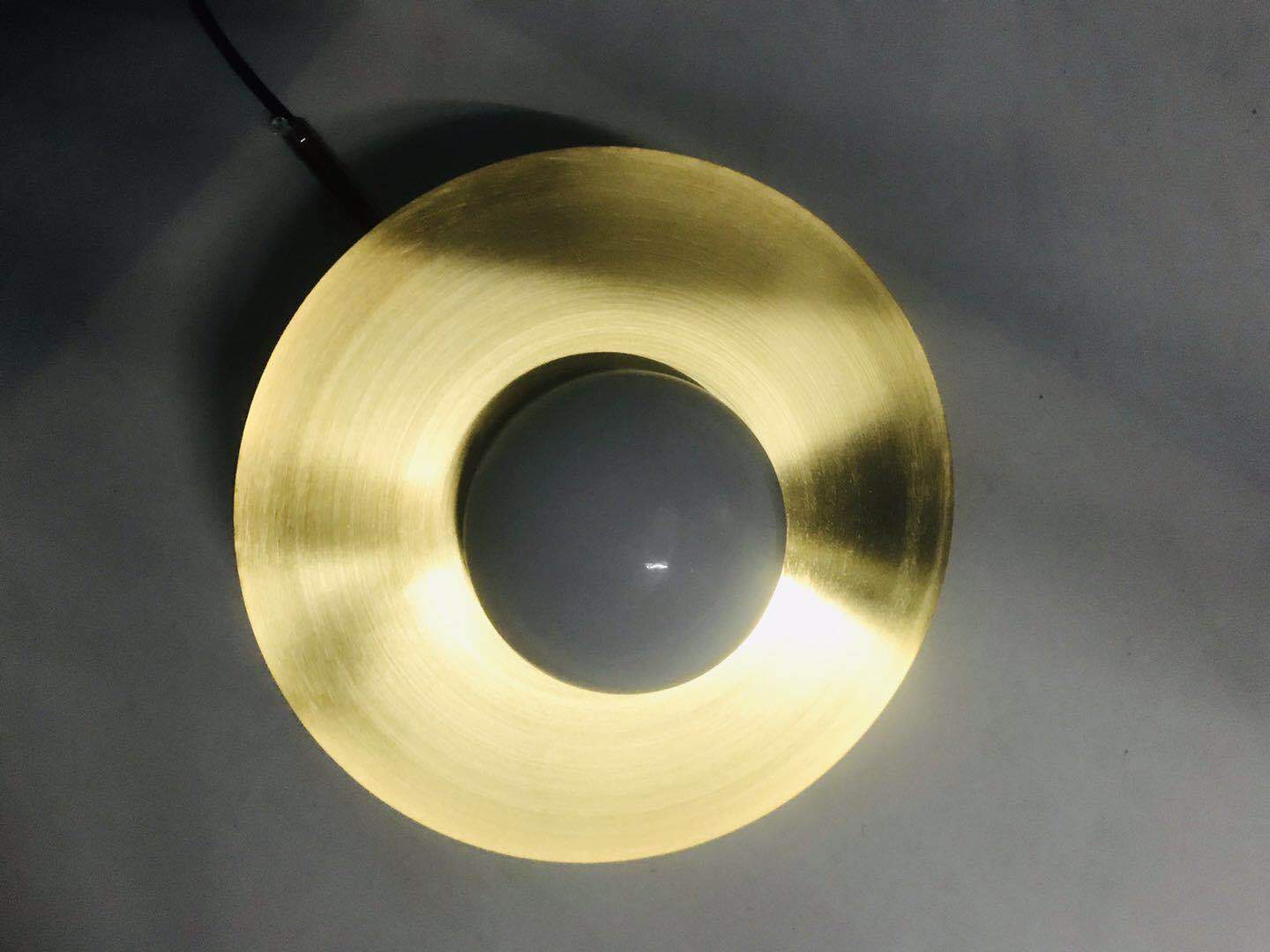 saturn-modern-celestial-sphere-pendant-light-with-swiveling-brass-ring-and-opal-glass-shade