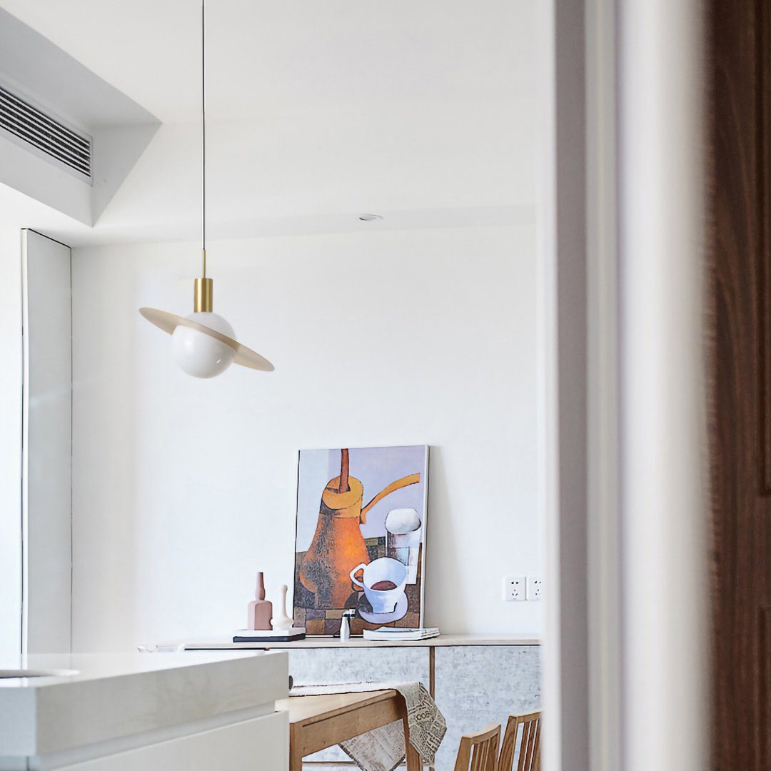 saturn-modern-celestial-sphere-pendant-light-with-swiveling-brass-ring-and-opal-glass-shade