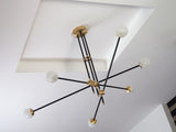 modern-hand-blown-glass-globe-chandelier-with-elegant-brass-and-copper-finishes