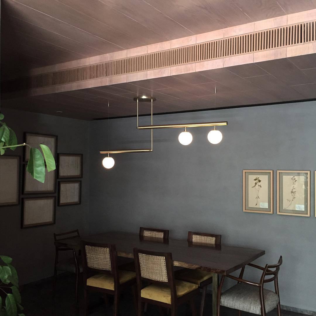 modern-geometric-satellite-pendant-light-with-opal-glass-globes-and-adjustable-brass-arms