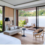 modern-solitaire-tripod-floor-lamp-with-black-polygonal-cloth-shade-and-brass-accents