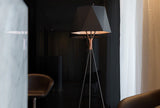 modern-solitaire-tripod-floor-lamp-with-black-polygonal-cloth-shade-and-brass-accents