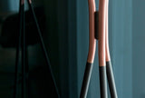 modern-solitaire-tripod-floor-lamp-with-black-polygonal-cloth-shade-and-brass-accents