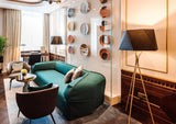 modern-solitaire-tripod-floor-lamp-with-black-polygonal-cloth-shade-and-brass-accents