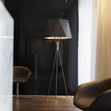 modern-solitaire-tripod-floor-lamp-with-black-polygonal-cloth-shade-and-brass-accents