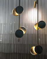 typography-cilon-disc-minimalist-led-pendant-lamp-sculptural-vertical-lighting-for-modern-living-space
