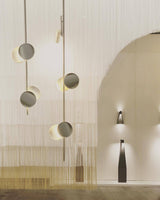 typography-cilon-disc-minimalist-led-pendant-lamp-sculptural-vertical-lighting-for-modern-living-space