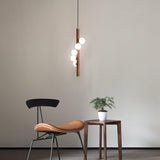Scandinavian Vertical Wood Column Pendant Light with White Glass Orbs for Modern Home Decor
