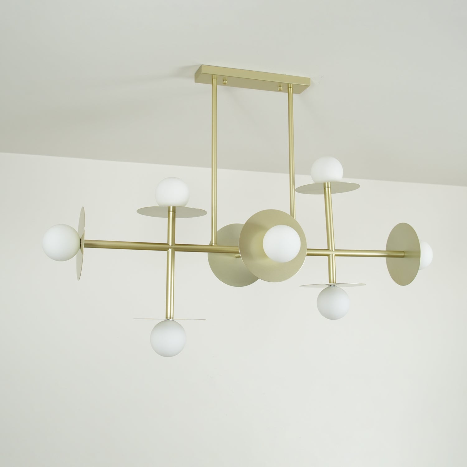 Strada Modern Starburst Chandelier with White Glass Globes and Metal Frame