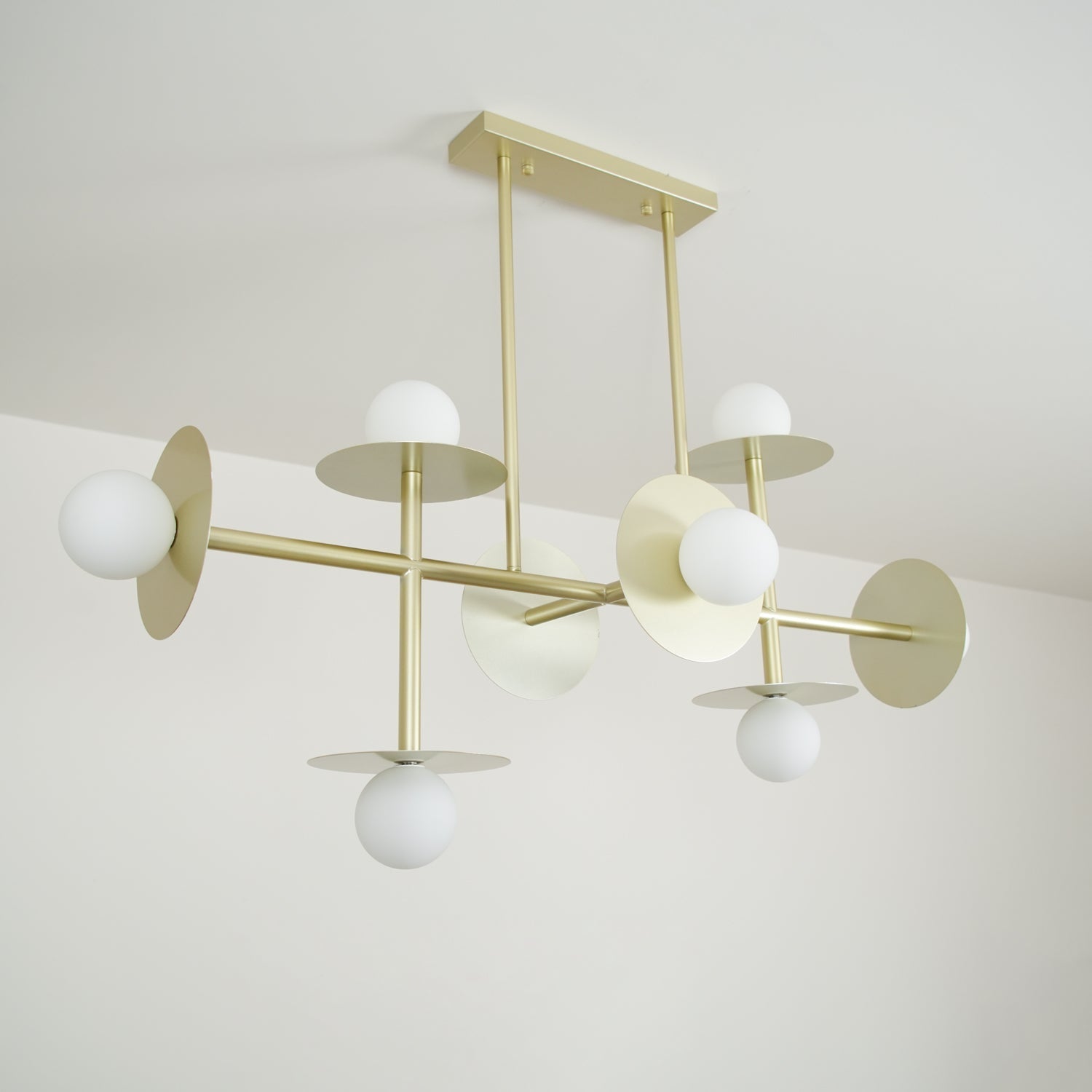 Strada Modern Starburst Chandelier with White Glass Globes and Metal Frame