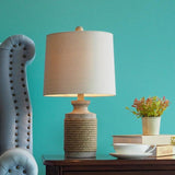 Vintage Coastal Style Stone Table Lamp with Rope Accents and Tapered Oatmeal Fabric Drum Shade