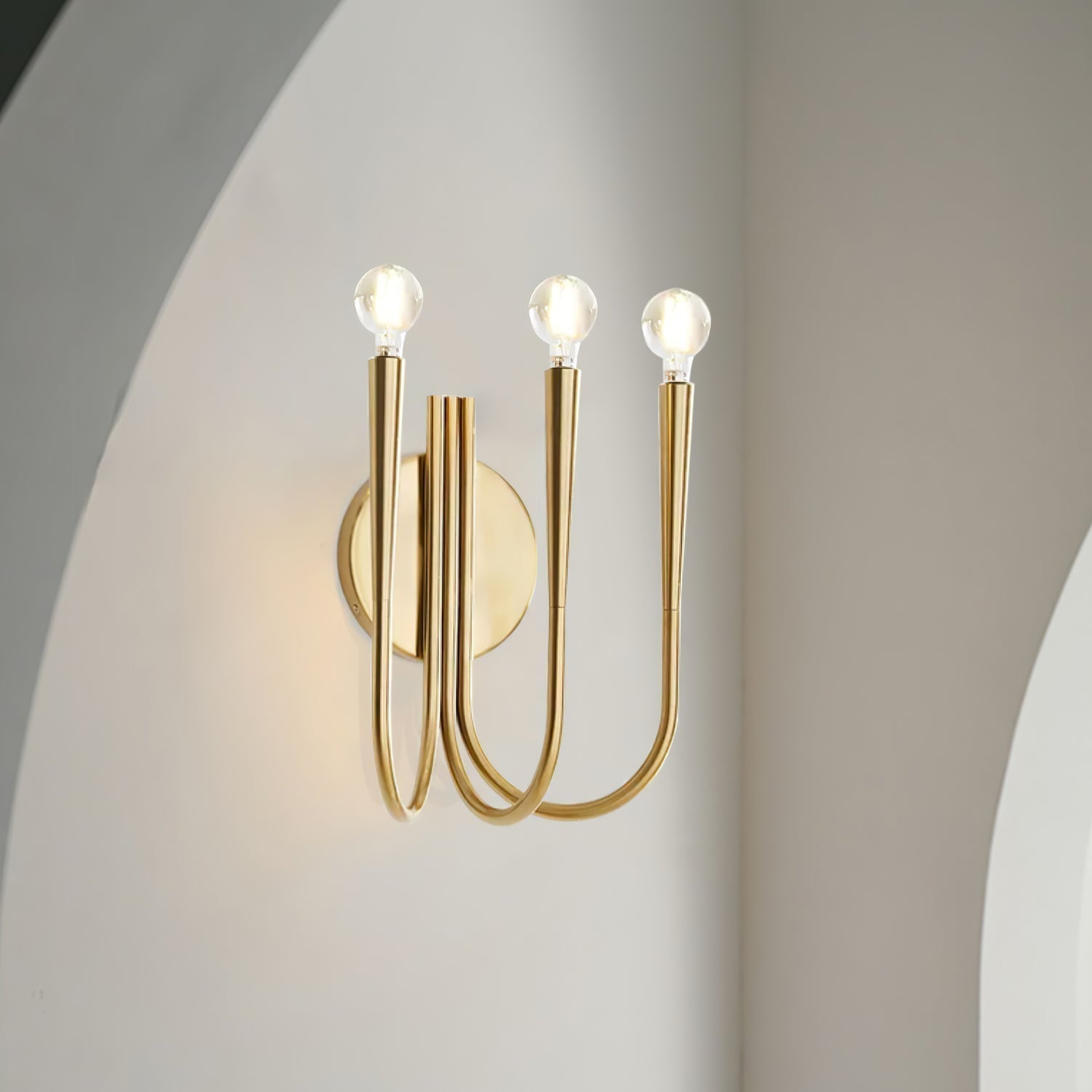 Vintage Curved Swoop Arm Wall Sconce with Clear Glass Globe Shade and Metal Finish