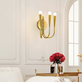 Vintage Curved Swoop Arm Wall Sconce with Clear Glass Globe Shade and Metal Finish