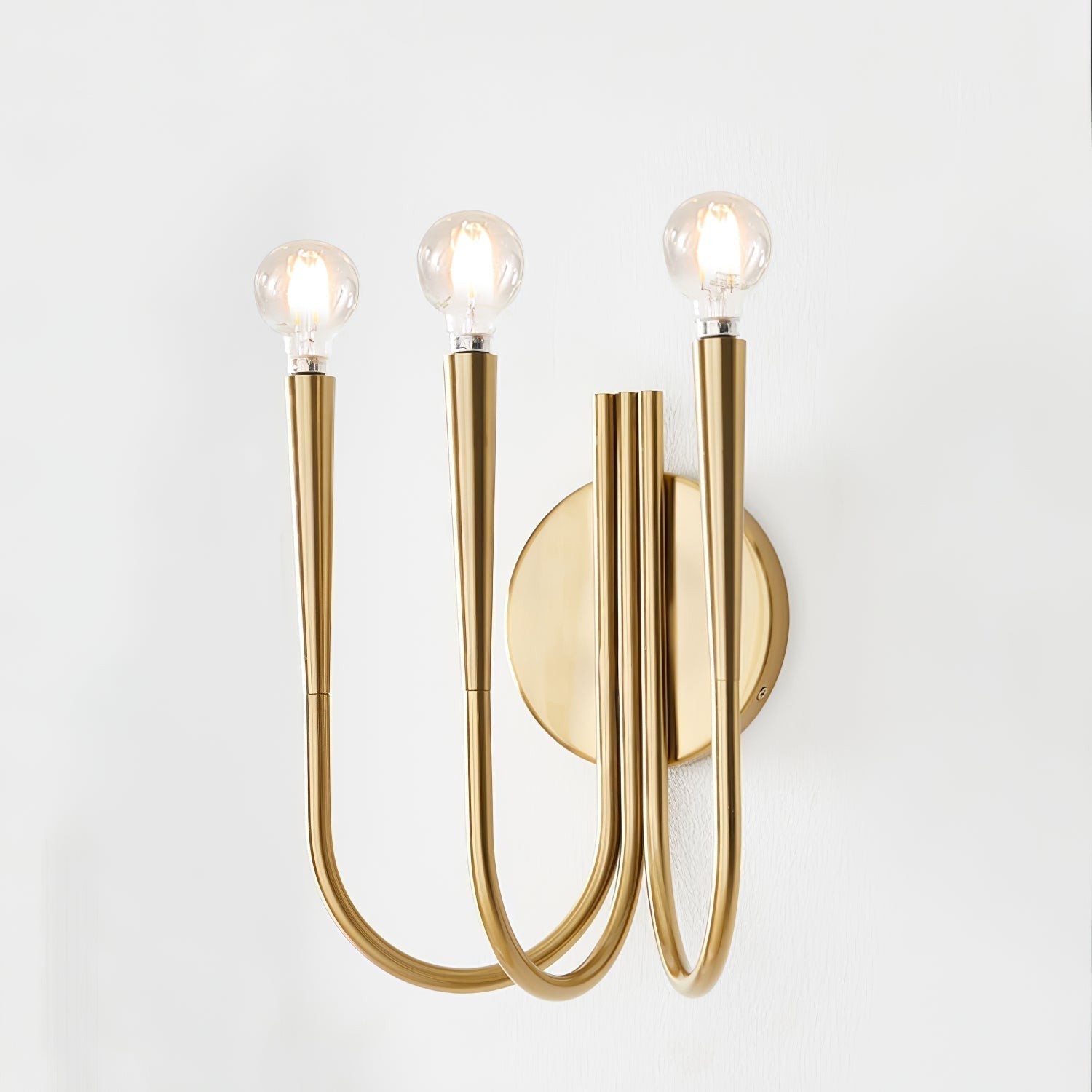 Vintage Curved Swoop Arm Wall Sconce with Clear Glass Globe Shade and Metal Finish