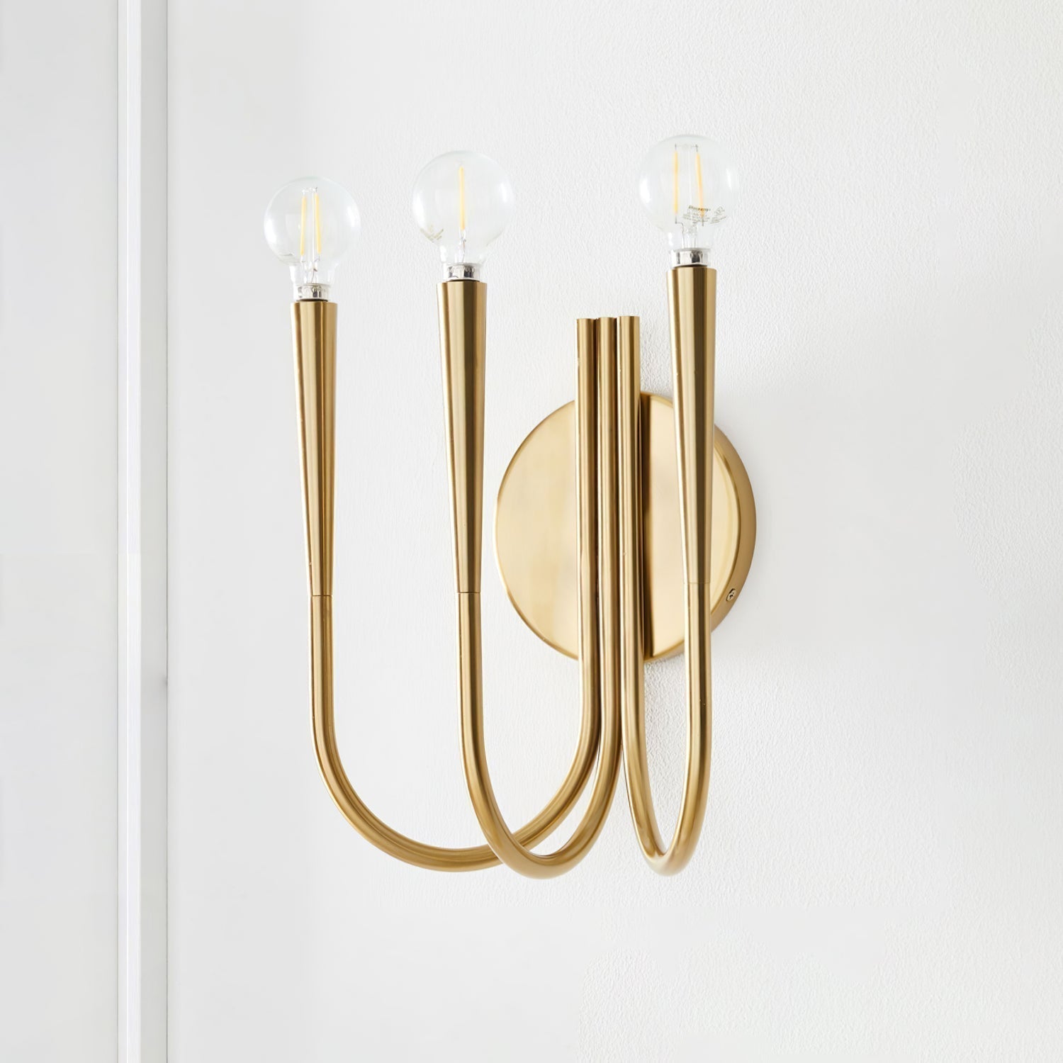 Vintage Curved Swoop Arm Wall Sconce with Clear Glass Globe Shade and Metal Finish